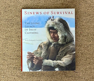 SINEWS OF SURVIVAL; THE LIVING LEGACY OF INUIT CLOTHING (HARDCOVER)